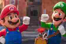 Mario and Luigi, characters from the Super Mario series, dressed in matching overalls with red and green shirts and hats, smile and gesture enthusiastically