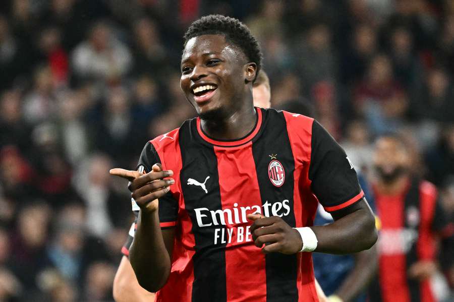 AC Milan's Alphadjo Cisse celebrates scoring his team's second goal