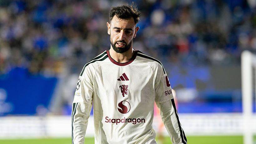 Bruno Fernandes looking dejected, while wearing a Manchester United away strip