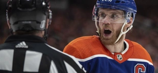 Canucks’ Carson Soucy suspended 1 game for cross-checking Oilers star Connor McDavid in the face