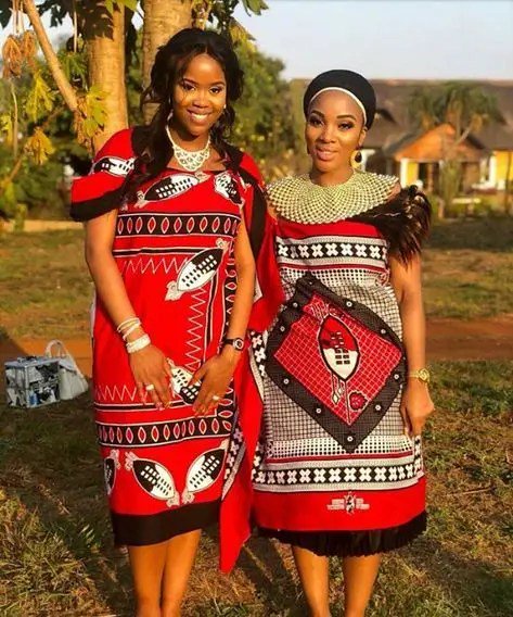 Two women wearing Swazi African traditional dresses