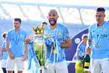 Sergio Aguero of Manchester City  celebrates with the Premier League Trophy after winning the title following the Premier League match between Brig...