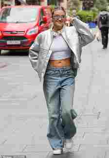 Ashley Roberts cut a casual figure as she showed off her abs in a crop top and baggy jeans as she left the Heart FM Studios on Tuesday
