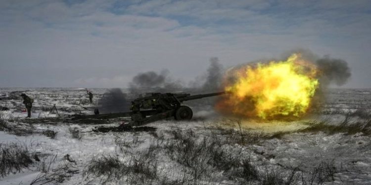 A Russian army service member fires a howitzer during drills at the Kuzminsky range in the southern Rostov region, Russia, January 26, 2022.
