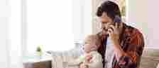 Father talking on call while taking care of kid 