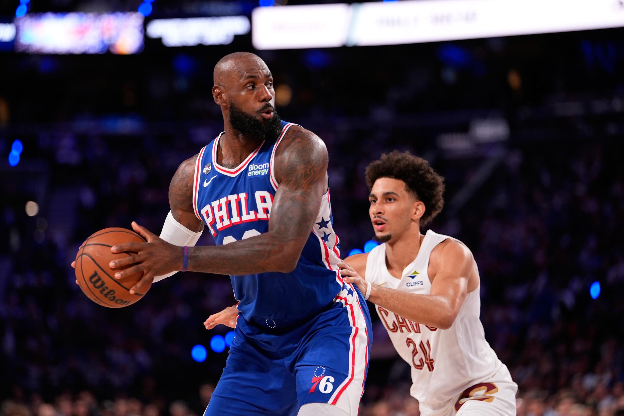 Philadelphia 76ers' LeBron James, left, tries to get past Cleveland Cavaliers' Tyrese Proctor during the first half of an NBA basketball game Thursday, October 22, 2026, in Philadelphia.