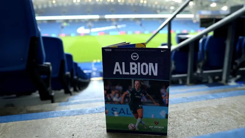 The match day programme is pictured inside the stadium before the Barclays Women's Super League 2026/27 match between Brighton & Hove Albion and West Ham United at Amex Stadium
