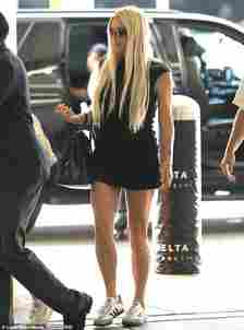 The star donned a fitted, black minidress that clung to her frame and contained a hem that stopped inches above her knees