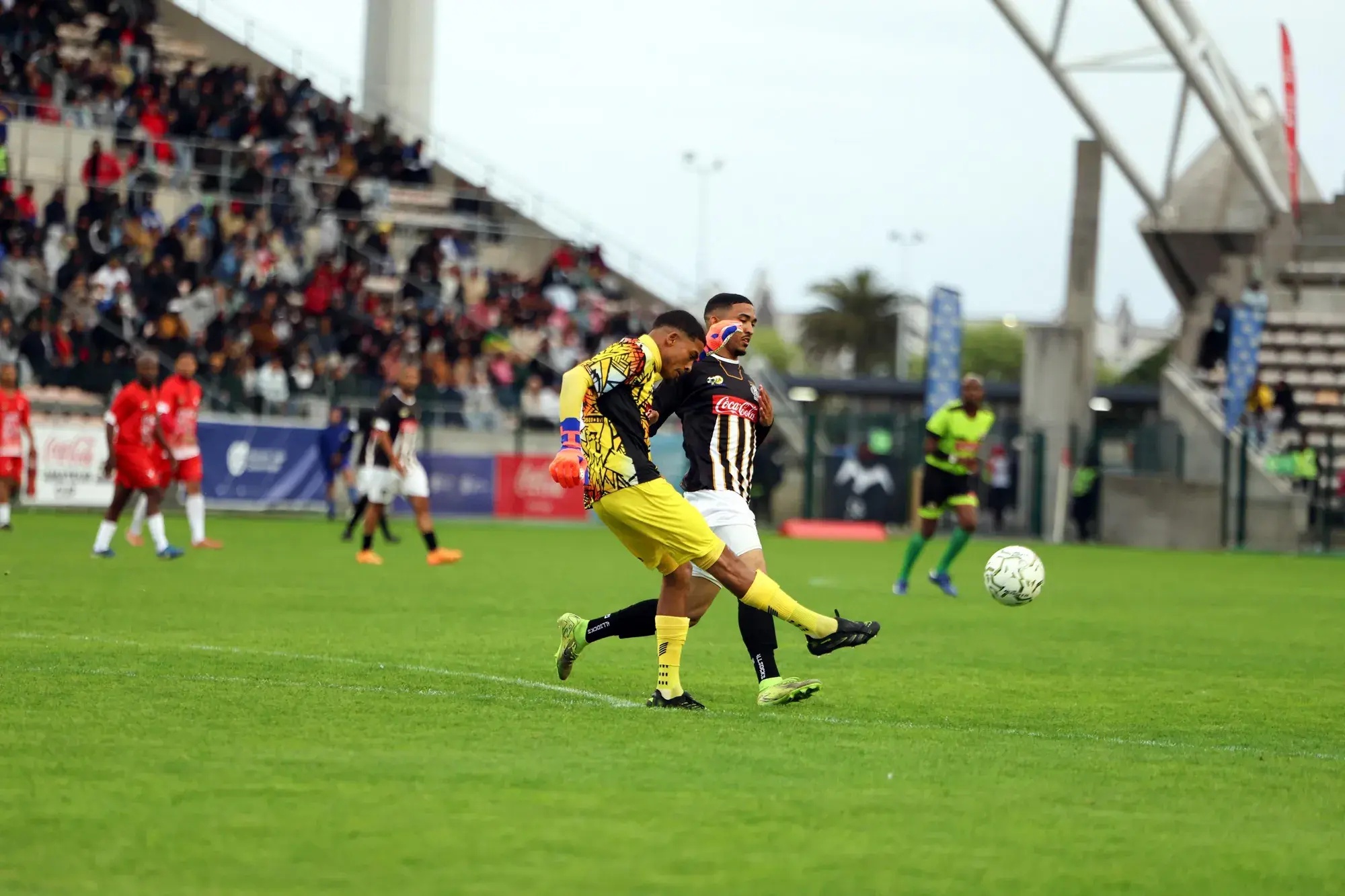 Hanover Park goalkeeper Shiraaj Wilks comes off his line to clear the ball during his side’s Coke Cup final against Saxon Rovers at Athlone Stadium on Saturday.