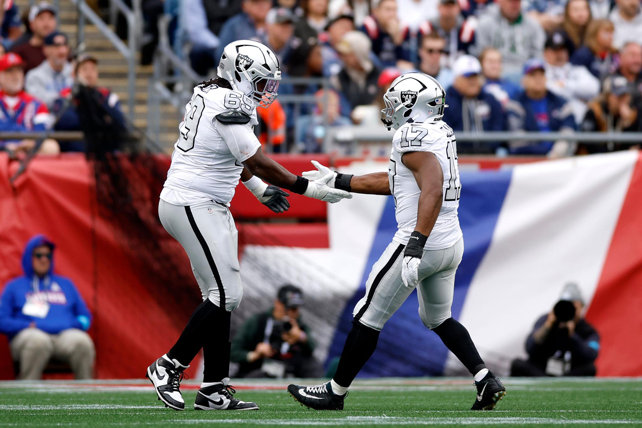 Raiders linebacker Nakobe Dean and defensive tackle Adam Butler