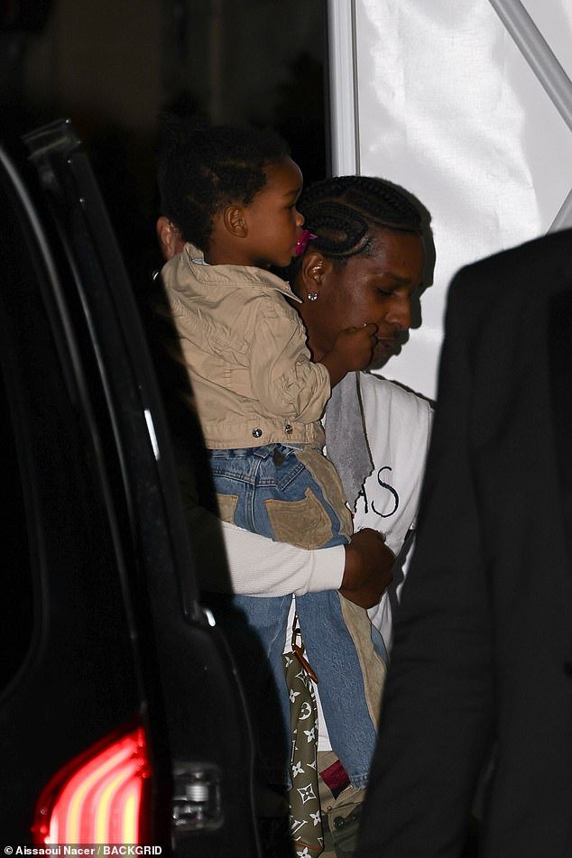 Carried away: The star's partner A$AP Rocky held their 22-month-old son