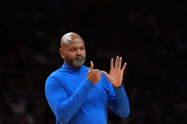 Detroit Pistons head coach J.B. Bickerstaff gestures during a time out in the first half of an NBA basketball game against the Miami Heat, Friday, Oct. 23, 2026, in Miami. (AP Photo/Rebecca Blackwell)