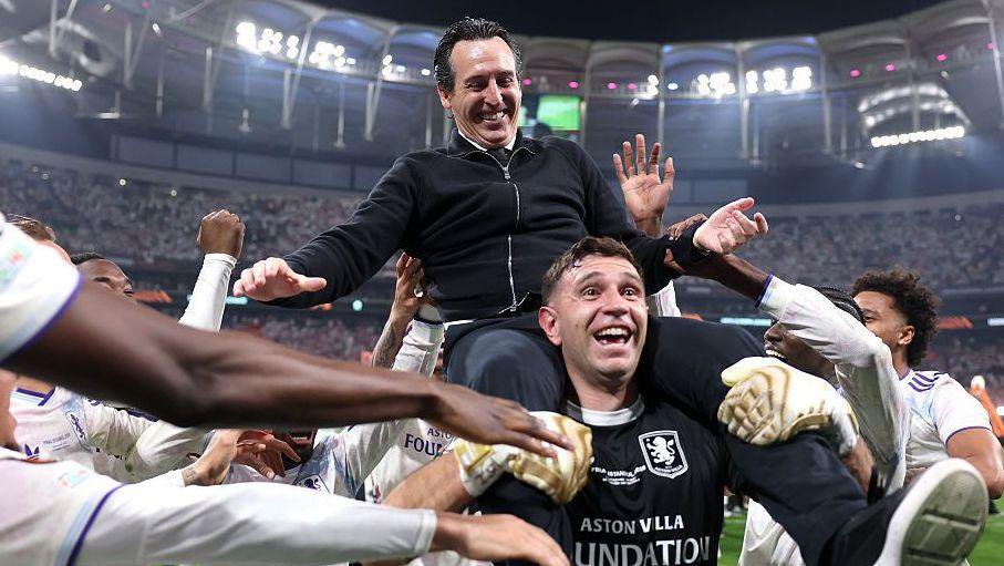 Unai Emery and former Villa goalkeeper Emi Martinez celebrate their Europa League final win