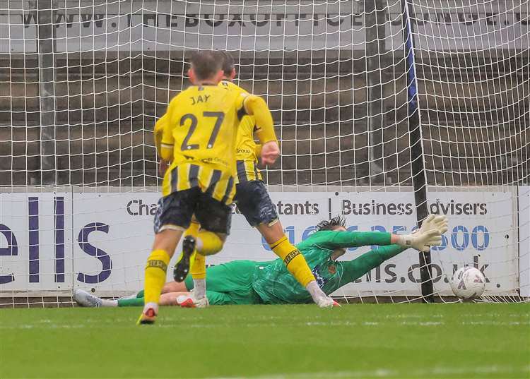 Maidstone keeper Lenny Holden denies Cody Cooke from the penalty spot. Picture: Helen Cooper