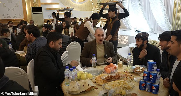 Routledge, a self-styled adventurer and explorer, (pictured, centre) documented his time at the event