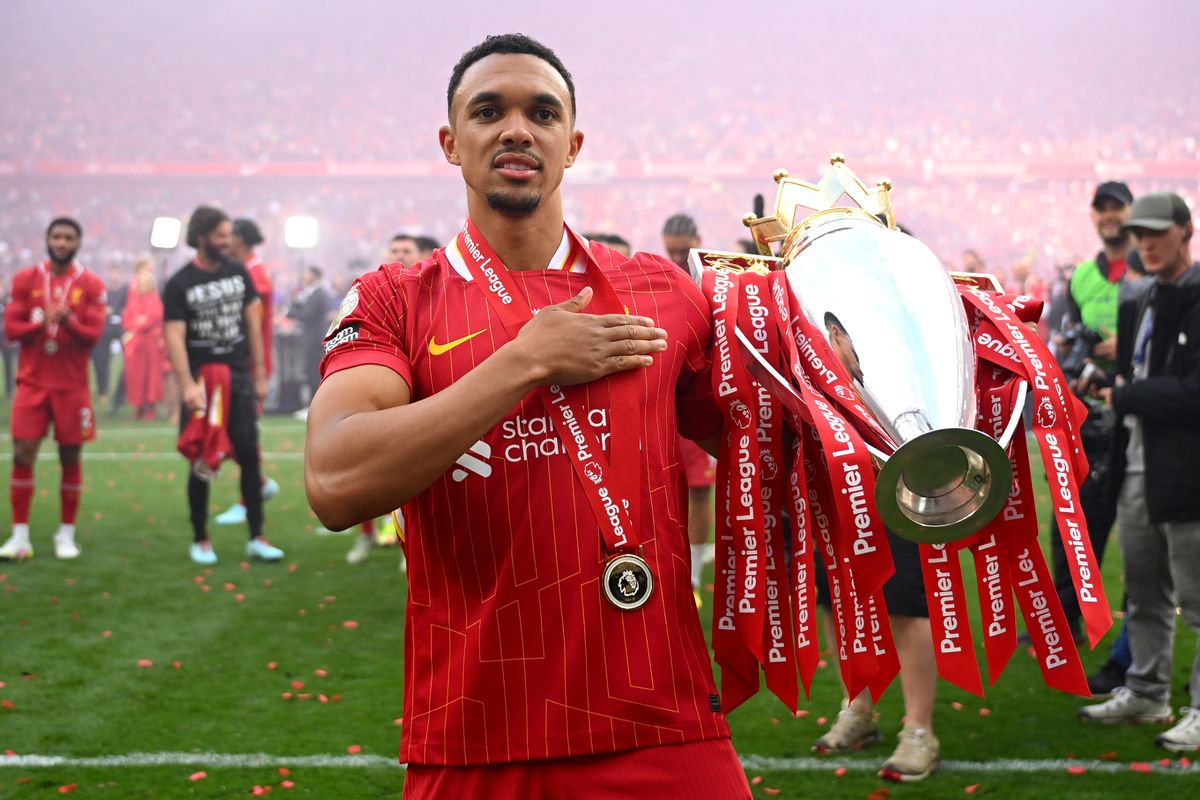 Trent Alexander-Arnold of Liverpool, celebrates with Premier League trophy after his final appearance for Liverpool as Liverpool are crowned the Champions of the Premier League for the 2024/25 Season, following the Premier League match between Liverpool FC and Crystal Palace FC at Anfield on May 25, 2025