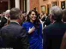 At King Charles's pre-Coronation reception last May, Kate stunned in a patriotic royal blue Self-Portrait dress with a criss-cross neckline. She also wore the Queen Mother's sapphire and diamond earrings, together with a sparkly silver clutch by Jenny Packham