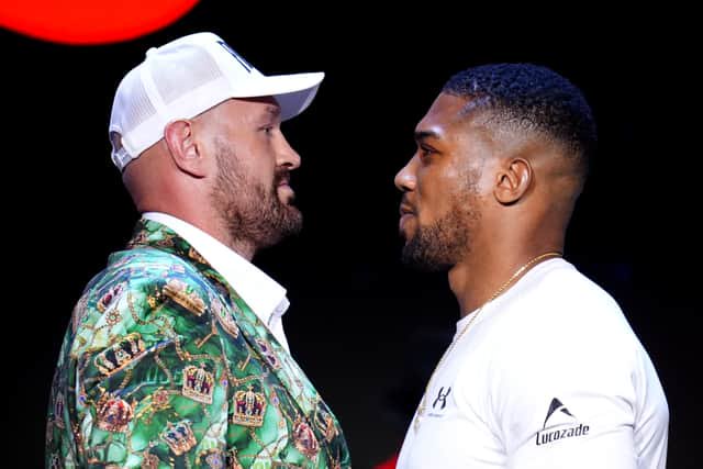 Tyson Fury (left) and Anthony Joshua facing off for the first time 