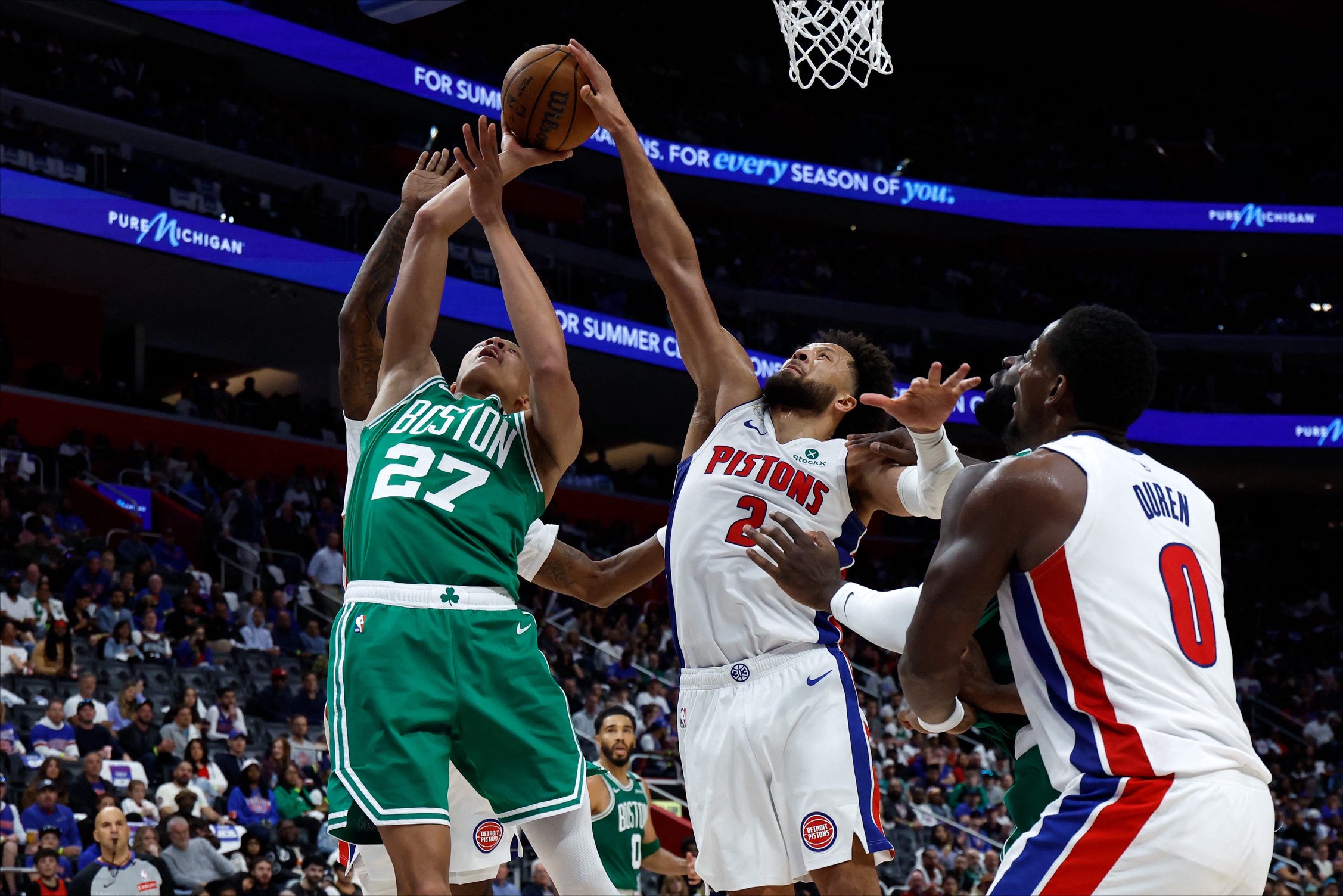Oct 20, 2026; Detroit, Michigan, USA;  Detroit Pistons guard Cade Cunningham (2) blocks a shot by Boston Celtics guard Jordan Walsh (27) in the second half at Little Caesars Arena.  Mandatory Credit: Rick Osentoski-Imagn Images