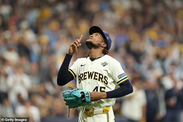 Abner Uribe #45 of the Milwaukee Brewers reacts as he walks back to the dugout after being pulled against the Tampa Bay Rays during the eighth inning