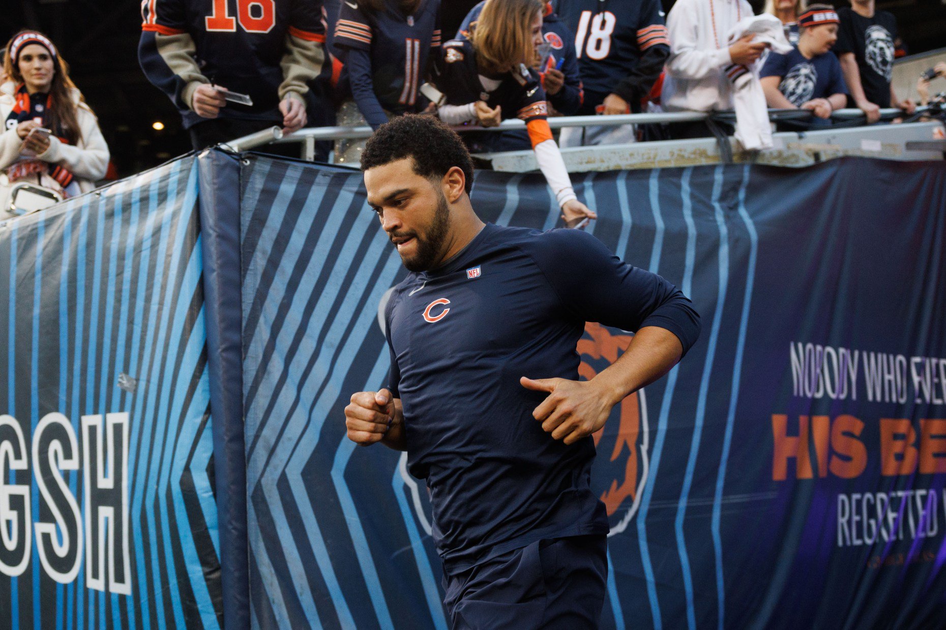 Bears quarterback Caleb Williams runs to the field to warm up before the Bears host the Patriots at Soldier Field on Oct. 22, 2026. (Armando L. Sanchez/Chicago Tribune)