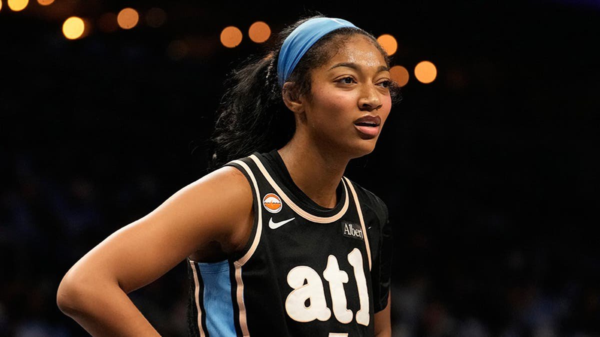 Angel Reese looks on during the first half of Game 3 of the WNBA Finals in Atlanta.