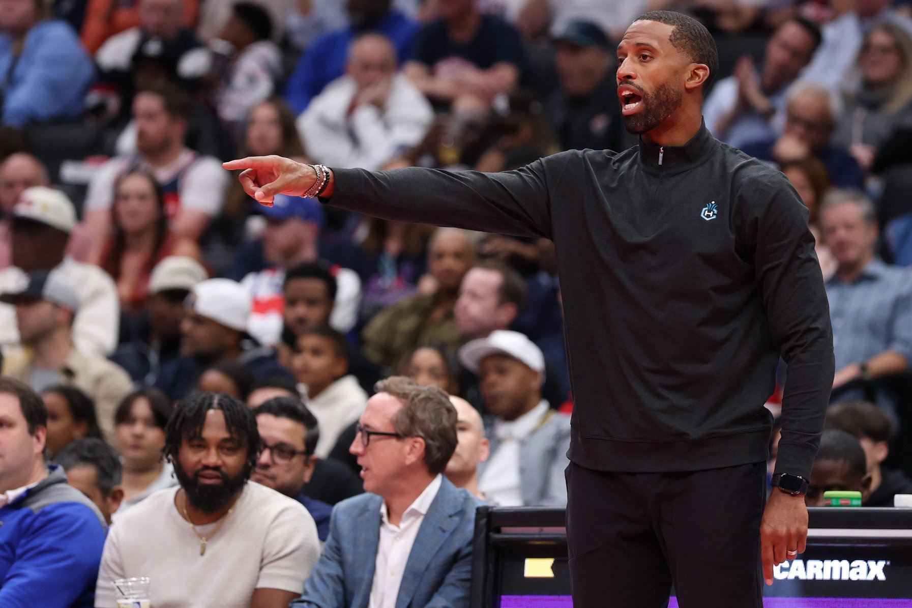 Oct 30, 2026; Washington, District of Columbia, USA; Charlotte Hornets head coach Charles Lee gestures from the bench against the Washington Wizards in the first half in an NBA Cup game at Capital One Arena. Mandatory Credit: Geoff Burke-Imagn Images