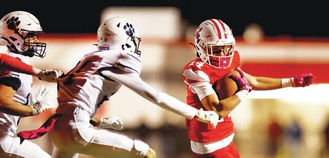 <p>Crestwood wide receiver Braylon Murray looks to turn the corner after making a catch in the second quarter as Berwick defensive back Brady McCabe closes in.</p>
                                 <p>Fred Adams | For Times Leader</p>