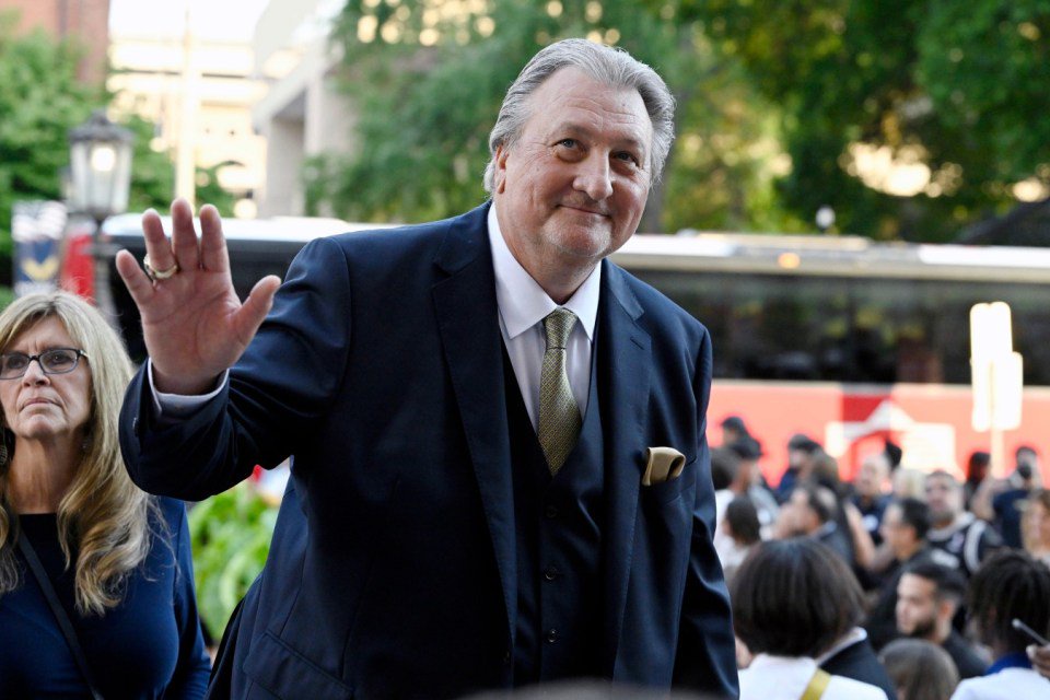 Bob Huggins waving to a crowd.
