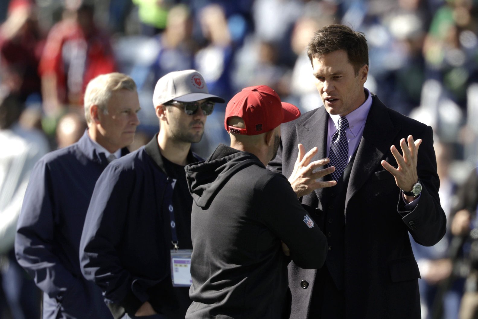 FOX Sports lead NFL analyst Tom Brady chats on the field before a game between the San Francisco 49ers and the Seattle Seahawks at Lumen Field. 