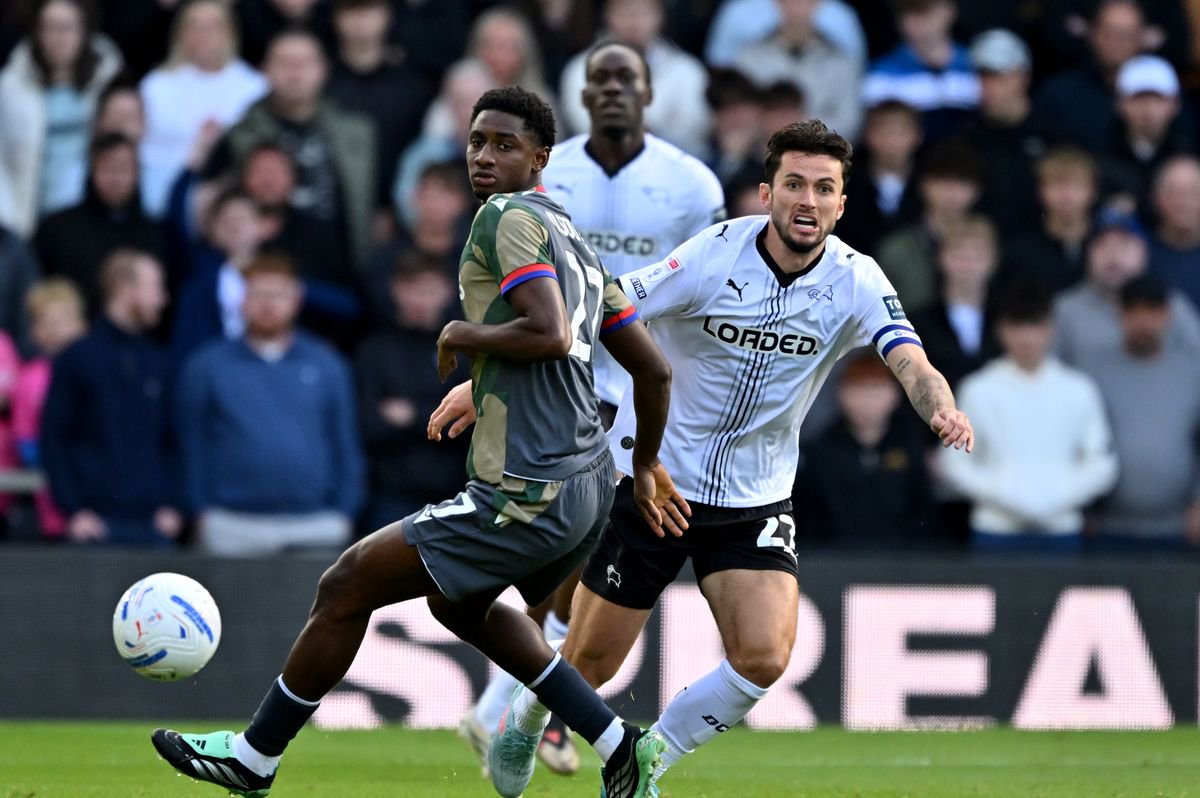 Derby County's Lewis Travis (right) suffered an ankle injury.