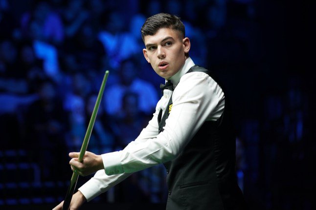 WUHAN, CHINA - AUGUST 23: Liam Davies of Wales reacts in the first round match against Ding Junhui of China on day 1 of Wuhan Open 2026 at the Optics Valley Gymnasium of Huazhong University of Science and Technology on August 23, 2026 in Wuhan, Hubei Province of China. (Photo by Tai Chengzhe/VCG via Getty Images)