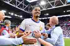 William Saliba of France celebrates victory with members of the coaching team after the UEFA EURO 2024 round of 16 match between France and Belgium...