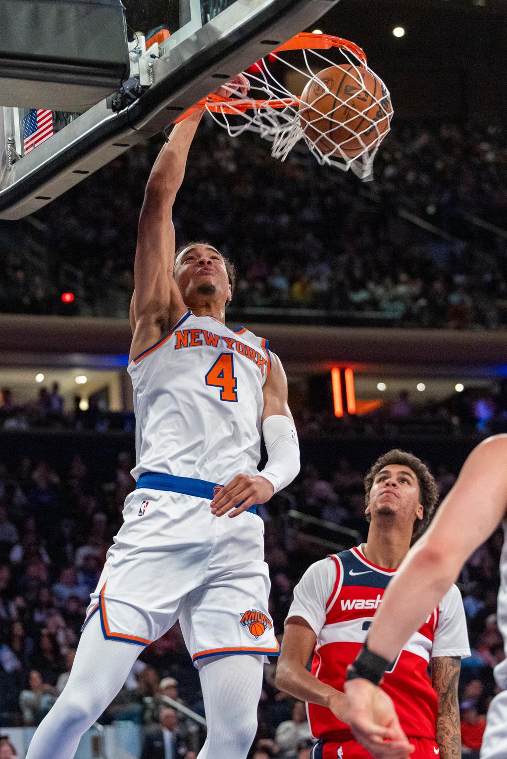 New York Knicks forward Pacome Dadiet dunks the ball against the Washington Wizards.