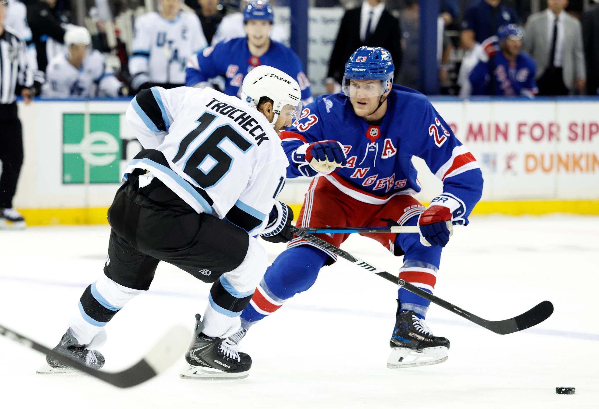 Utah Mammoth center Vincent Trocheck (16) faces off against New York Rangers defenseman Adam Fox (23) during the first period of an NHL hockey game at Madison Square Garden in New York, Sunday, Oct. 4, 2026.