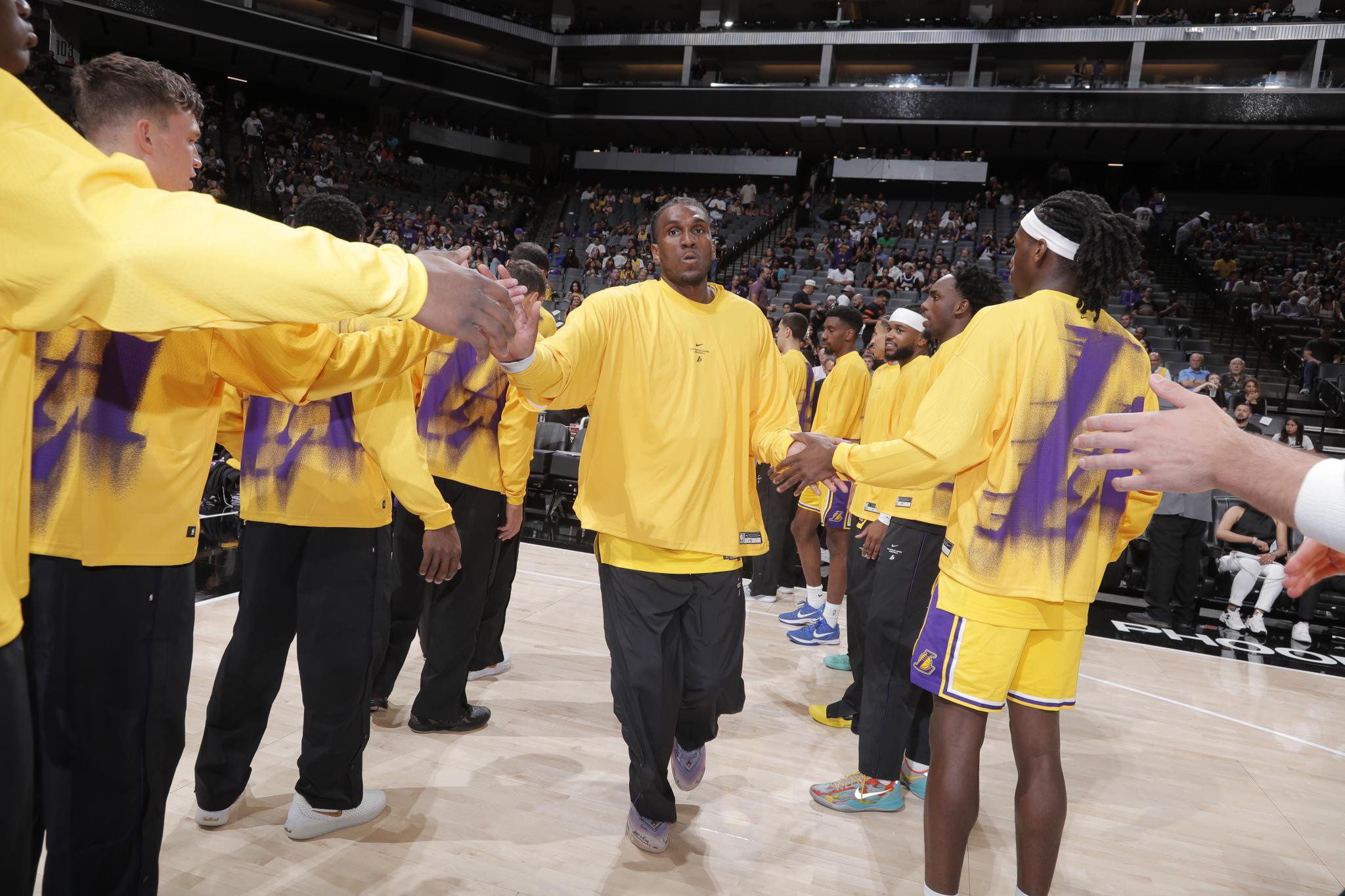 Kevon Looney of the Los Angeles Lakers is introduced into the starting lineup prior to an NBA preseason game against the Sacramento Kings.