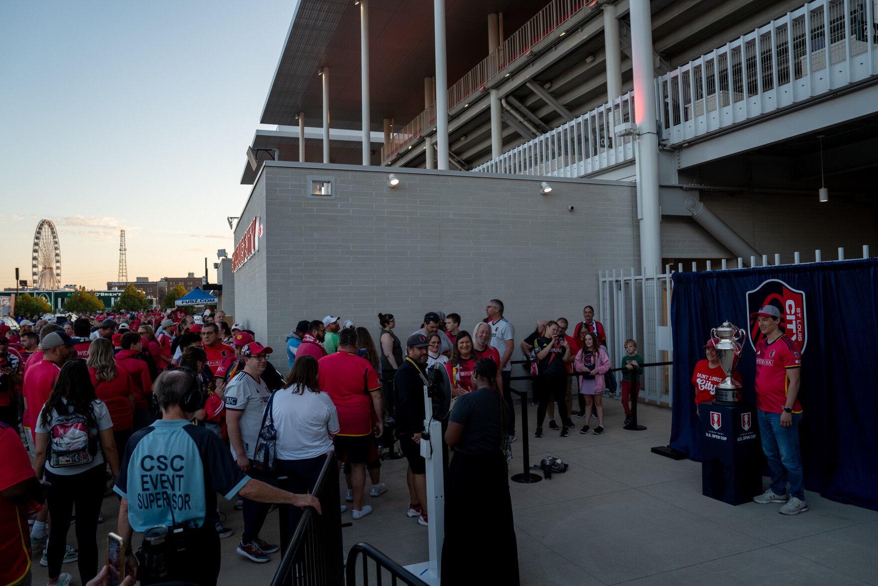 St. Louis City SC supporters line up to pose for photos with the Lamar Hunt U.S. Open Cup trophy outside Energizer Park on Wednesday, Oct. 28, 2026, in St. Louis’ Downtown West neighborhood.