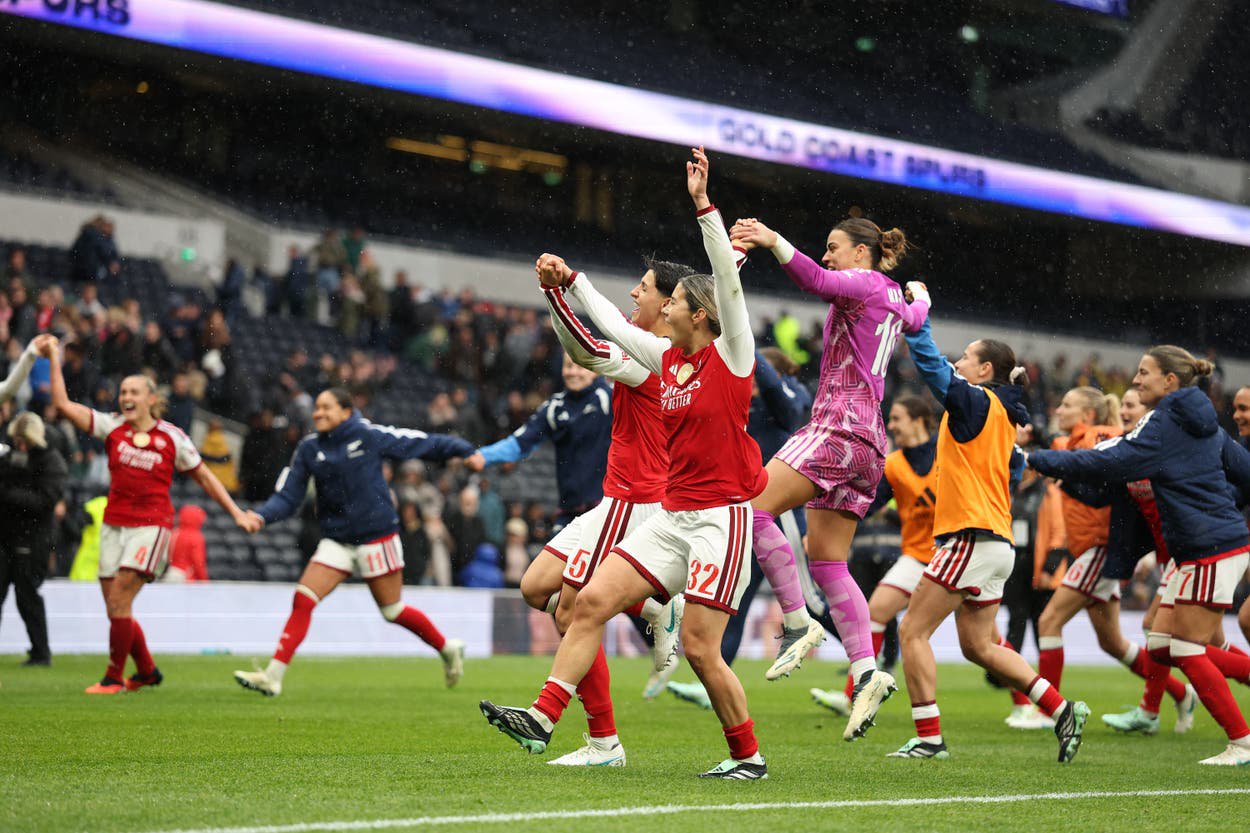 Arsenal players celebrate their 2-1 win at Tottenham