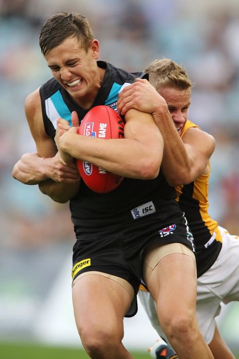 ADELAIDE, AUSTRALIA - MAY 11: Daniel Stewart of the Power is tackled by Brandon Ellis of the Tigers during the round seven AFL match between Port Adelaide Power and the Richmond Tigers at AAMI Stadium on May 11, 2013 in Adelaide, Australia. (Photo by Morne de Klerk/Getty Images)