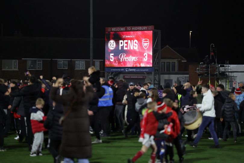Fleetwood fans invade the pitch as they celebrate winning the English League Cup fourth round football match between Fleetwood Town and Arsenal at Highbury Stadium