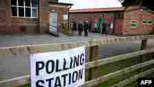 Voters arrive to a polling station at the Scout & Guide headquarters in Sowerby, north of England, July 4, 2024 as Britain holds a general election. Polls are predicting that Labour will win its first general election since 2005.