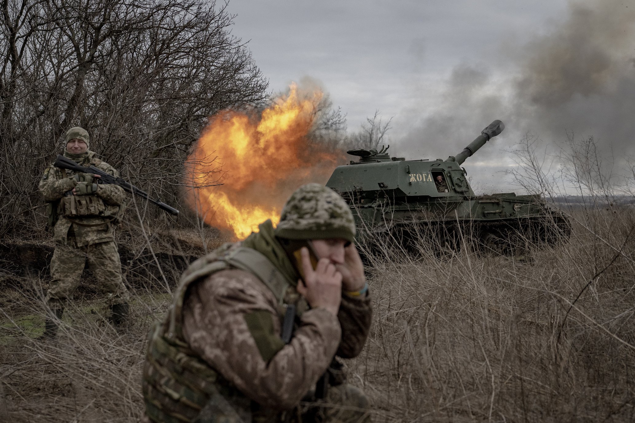 A Ukrainian soldier fires towards the Russian position close to Avdiivka