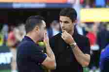 Mikel Arteta, Manager of Arsenal, talks with Xavi, Head Coach of FC Barcelona, prior to the Pre-Season Friendly match between Arsenal and FC Barcel...