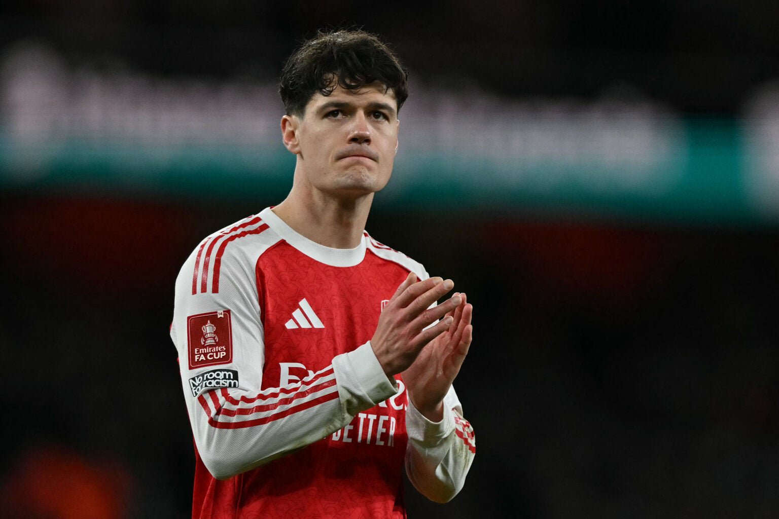Christian Norgaard applauds the Arsenal fans after a game