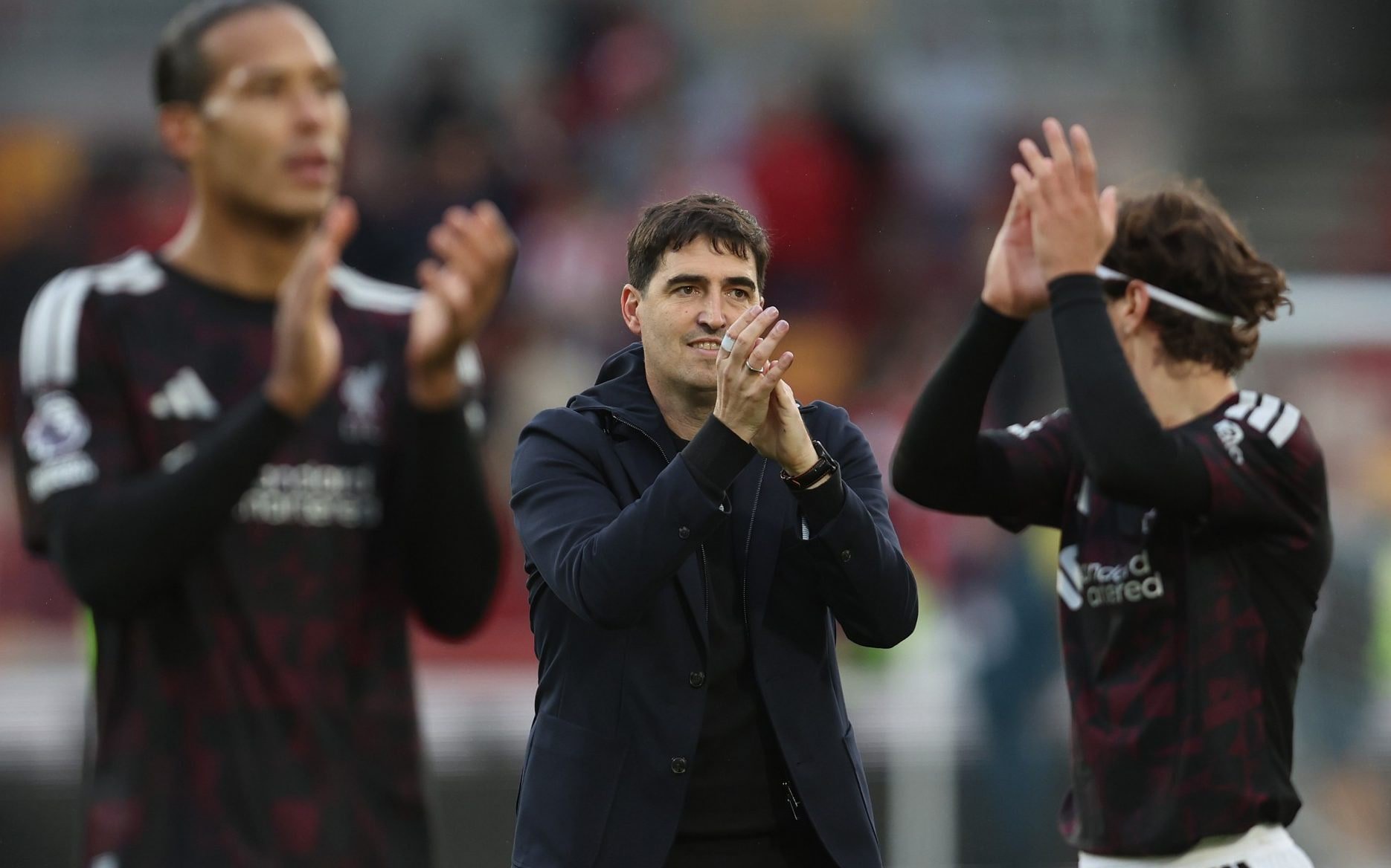 Liverpool manager Andoni Iraola applauds the fans