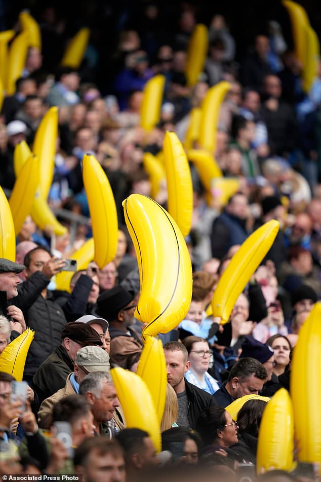 Manchester City fans wave inflatable bananas during the English Premier League soccer match between Manchester City and Ipswich Town, in Manchester, England, Saturday, Oct.17, 2026. (AP Photo/Dave Thompson)