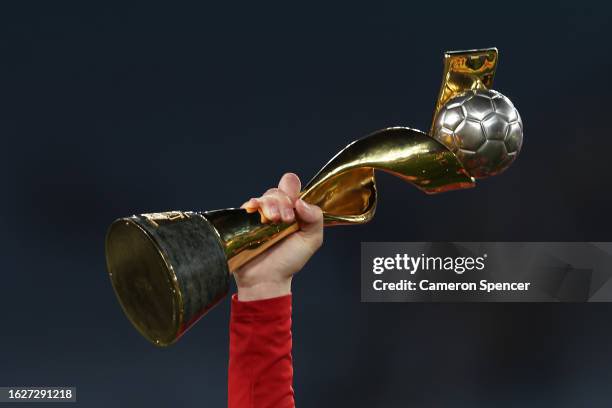 A Spain player holds up the FIFA Women's World Cup Trophy after the FIFA Women's World Cup Australia & New Zealand 2023 Final match between Spain and England at Stadium Australia on August 20, 2023 in Sydney, Australia. (Photo by Cameron Spencer/Getty Images)