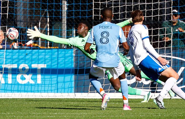 New York City FC midfielder Andrés Perea (8) kicks the ball by CF Montréal goalkeeper Samsy Keita (41) for a goal during the first half of an MLS soccer match, Saturday, Oct. 31, 2026, in New York. (AP Photo/Noah K. Murray)