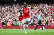 Bukayo Saka of Arsenal celebrates scoring his team's first goal from a penalty kick during the Premier League match between Arsenal FC and AFC Bournemouth at Emirates Stadium on May 04, 2024 in London, England.