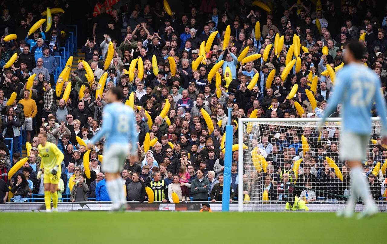 Manchester City fans with inflatable bananas 